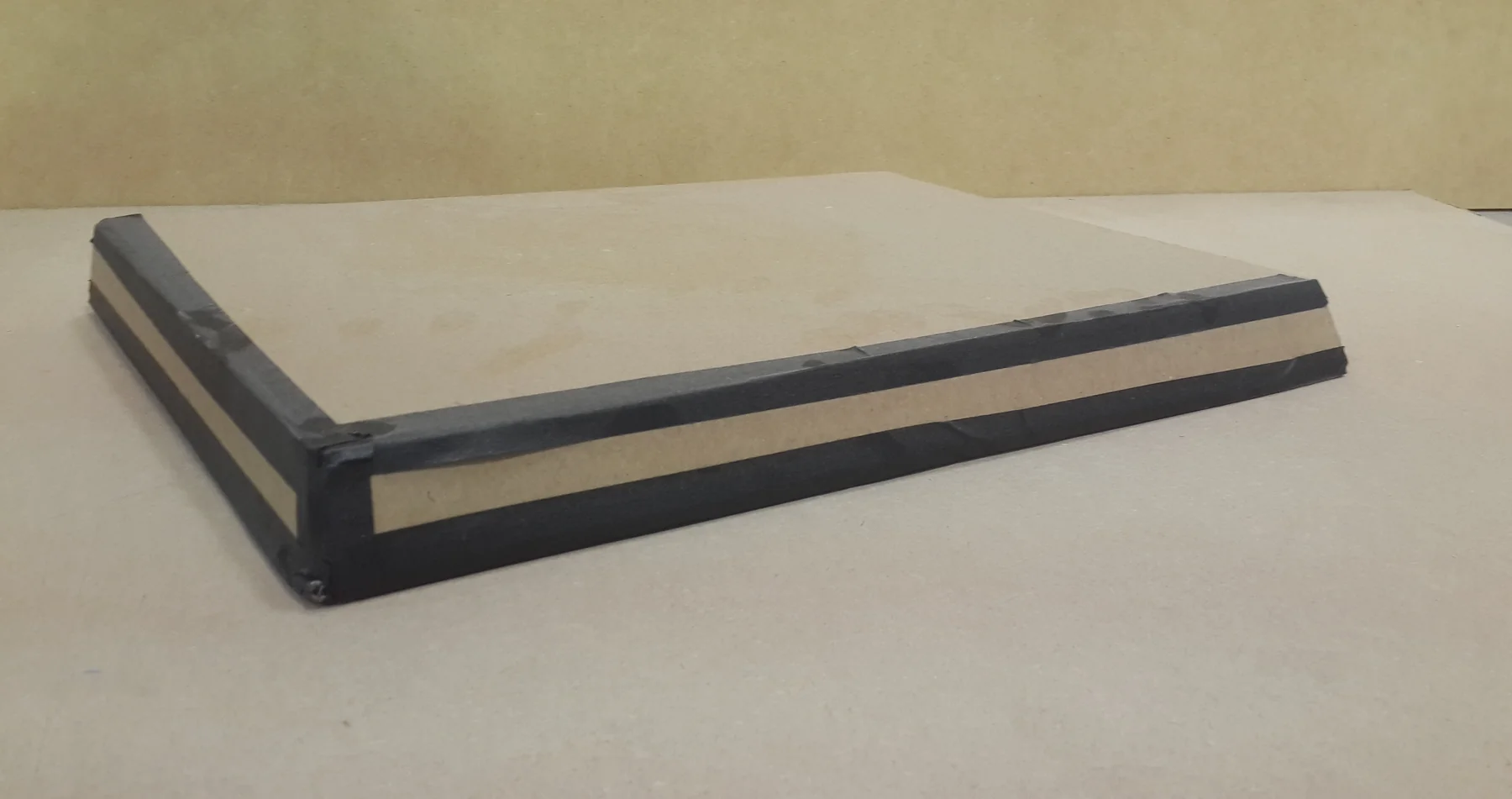 Mockup of the cutting board edge, layered black and tan