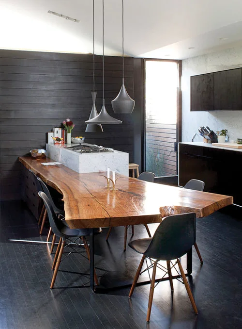Moodboard reference: dark kitchen with a live-edge wood table and black pendants